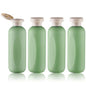 Empty Shampoo Bottles 6.7oz - Large Size Refillable Plastic Liquids Toiletry Containers - Empty Leak Proof Lotion Toiletries Dispenser - Green Flip Cap Top Body Wash and Cosmetic Set 4 Pack - color: Green