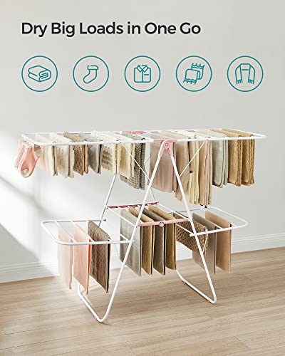 SONGMICS Clothes Drying Rack, Foldable 2-Level Laundry Drying Rack, Free-Standing Laundry Airer, with Height-Adjustable Wings, 33 Drying Rails, Sock Clips, White and Pink ULLR053P01V1 - color: White + Pink, size: 2 Tiers（22"d x 61.8"w x 64.3''h )